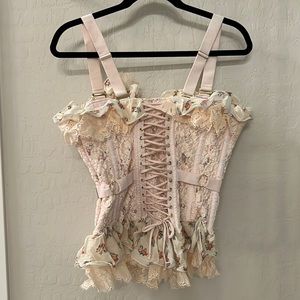 Lacey pink corset.  Very feminine and pretty.  Straps are adjustable.